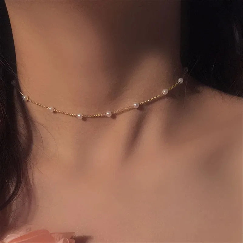 Gold pearl choker necklace